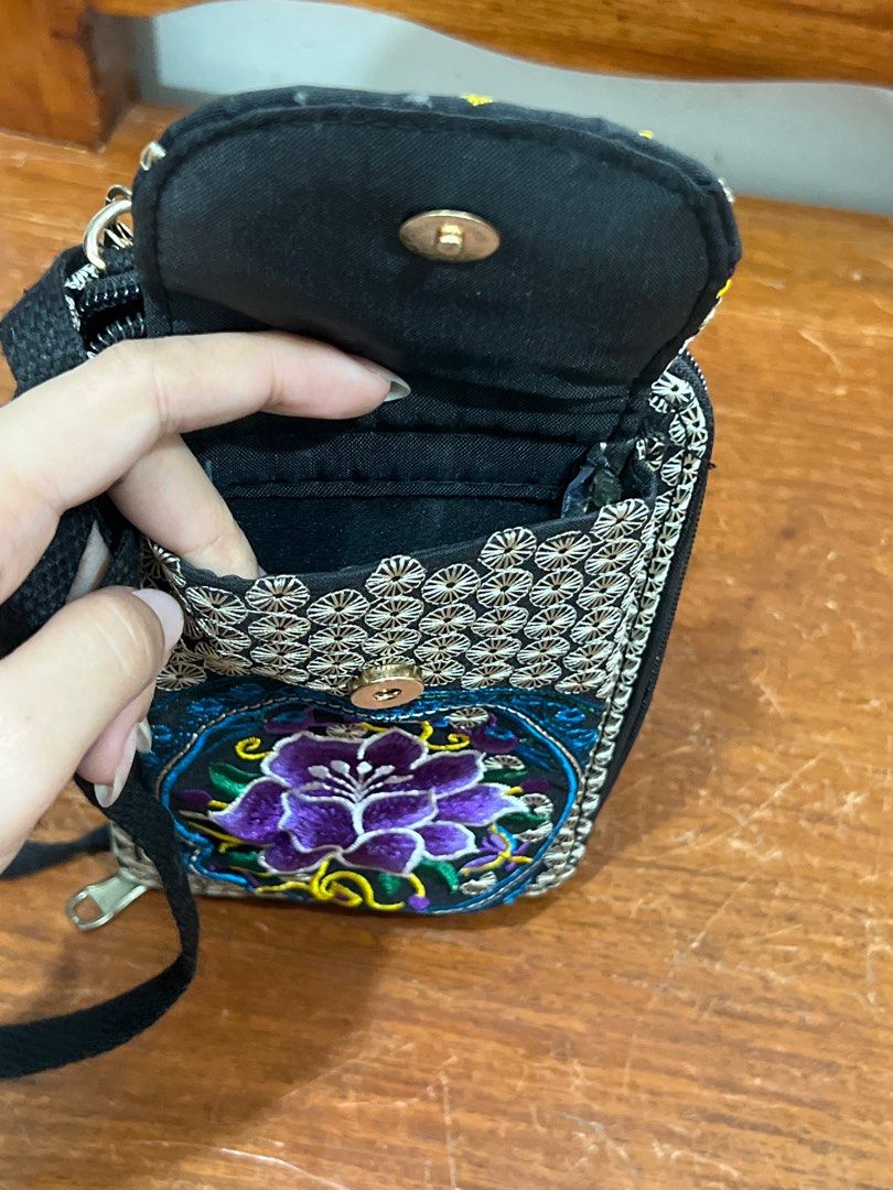 Mercari Embroidered Floral Wallet with Strap (Category: Wallets & Card holders) located in Quezon City. Submitted by _liliaceae (Listing ID 1408550313, Image 2). Description: - Floral embroidered wallet - Colors: Purple, blue, and yellow - Zip-around closure - Detachable strap - Multiple card and cash compartments - Zippered pocket - Small front flap with snap closure.