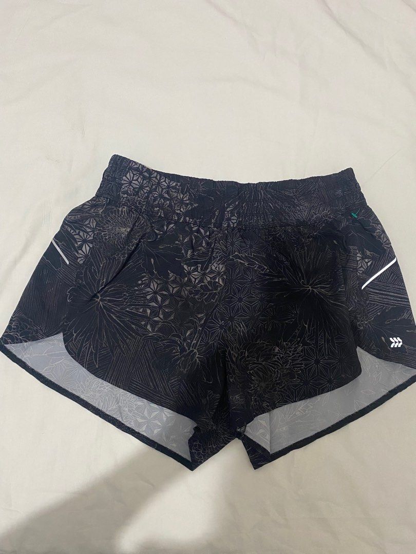 Miler Running Shorts (Category: Shorts) located in San Ildefonso. Submitted by msdzer (Listing ID 1408584530, Image 2). Description: - Floral patterned running shorts - Built-in brief for comfort and support - Reflective details for visibility - Waistband: Approximately 15 inches - Lightweight design, ideal for running.