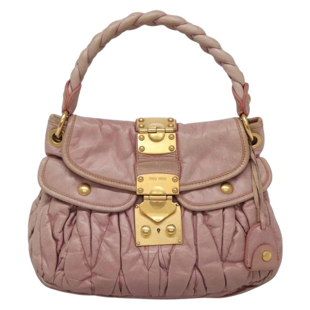 Miu Miu Madras Handbag (Category: Luxury Bags & Wallets) located in Santo Tomas. Submitted by pamana88fashionboutique (Listing ID 1408602186, Image 1). Description: - Authentic Miu Miu Madras handbag - Lovely pink color - Braided top handle - Gold-tone hardware - Flap closure with turn-lock - Branded leather tag inside - Shows some marks on the leather - Stylish and recognizable ***ISSUE LAST PIC***.