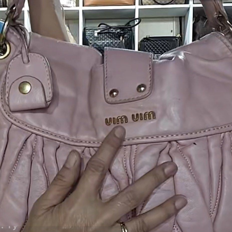 Miu Miu Madras Handbag (Category: Luxury Bags & Wallets) located in Santo Tomas. Submitted by pamana88fashionboutique (Listing ID 1408602186, Image 3). Description: - Authentic Miu Miu Madras handbag - Lovely pink color - Braided top handle - Gold-tone hardware - Flap closure with turn-lock - Branded leather tag inside - Shows some marks on the leather - Stylish and recognizable ***ISSUE LAST PIC***.