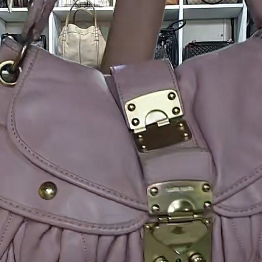 Miu Miu Madras Handbag (Category: Luxury Bags & Wallets) located in Santo Tomas. Submitted by pamana88fashionboutique (Listing ID 1408602186, Image 2). Description: - Authentic Miu Miu Madras handbag - Lovely pink color - Braided top handle - Gold-tone hardware - Flap closure with turn-lock - Branded leather tag inside - Shows some marks on the leather - Stylish and recognizable ***ISSUE LAST PIC***.