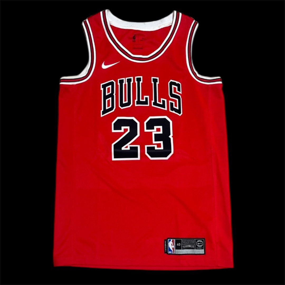 Nike Swingman Michael Jordan Chicago Bulls Jersey (Category: Activewear) located in Valenzuela. Submitted by gotdrip (Listing ID 1408628596, Image 1). Description: - Authentic Nike Michael Jordan Chicago Bulls jersey - Features iconic Bulls logo and number 23 - Includes NBA Swingman logo and NikeConnect technology - Size 40 - Classic red, white, and black color scheme - Ideal for basketball enthusiasts.