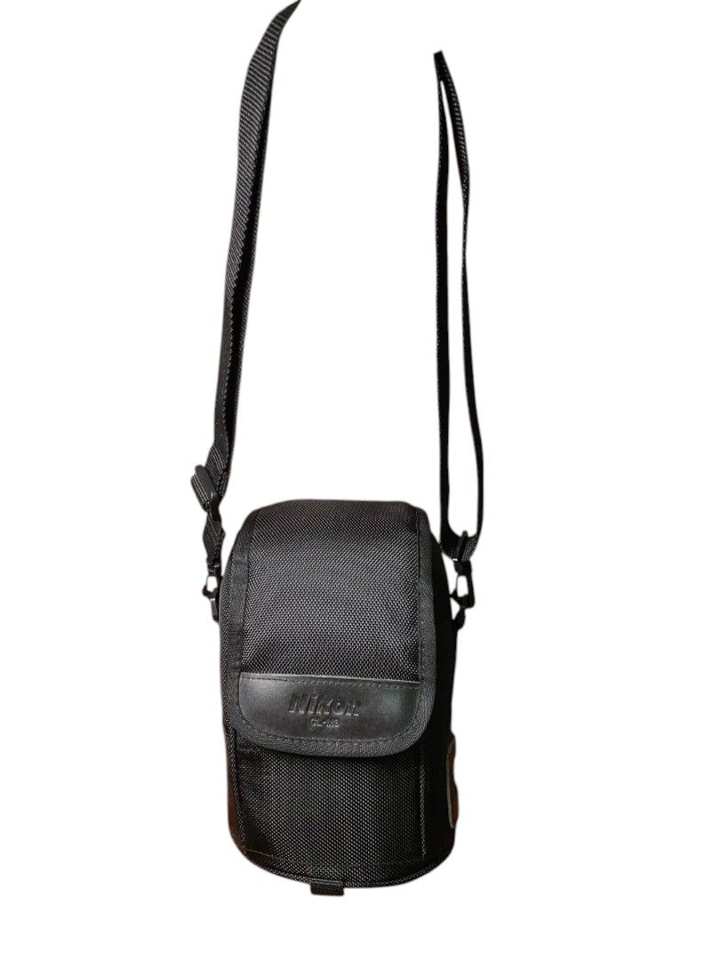 Nikon Cam Bag (Category: Camera Bags & Carriers) located in Andop. Submitted by source8600 (Listing ID 1408674980, Image 3). Description: It is a replacement case for the Nikon AF-S NIKKOR 14-24mm f/2.8G and AF-S NIKKOR 24-70mm f/2.8G lenses. The case is made of durable ballistic nylon material. It features a padded interior to protect lenses from shocks and scratches. The case includes a secure hook and loop fastener and an attached carrying str