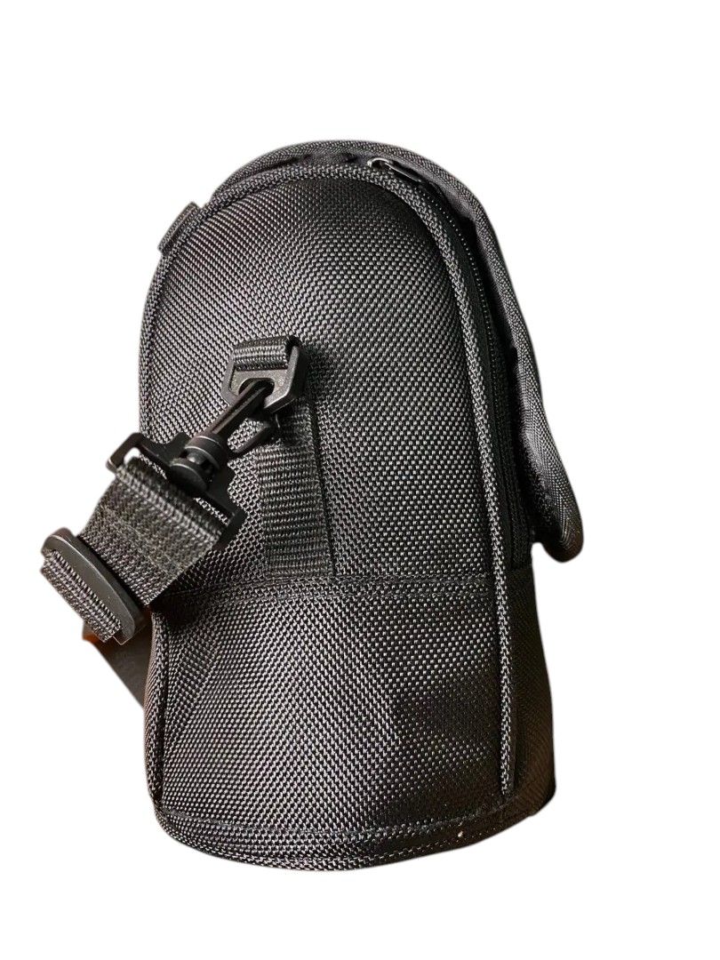 Nikon Cam Bag (Category: Camera Bags & Carriers) located in Andop. Submitted by source8600 (Listing ID 1408674980, Image 2). Description: It is a replacement case for the Nikon AF-S NIKKOR 14-24mm f/2.8G and AF-S NIKKOR 24-70mm f/2.8G lenses. The case is made of durable ballistic nylon material. It features a padded interior to protect lenses from shocks and scratches. The case includes a secure hook and loop fastener and an attached carrying str