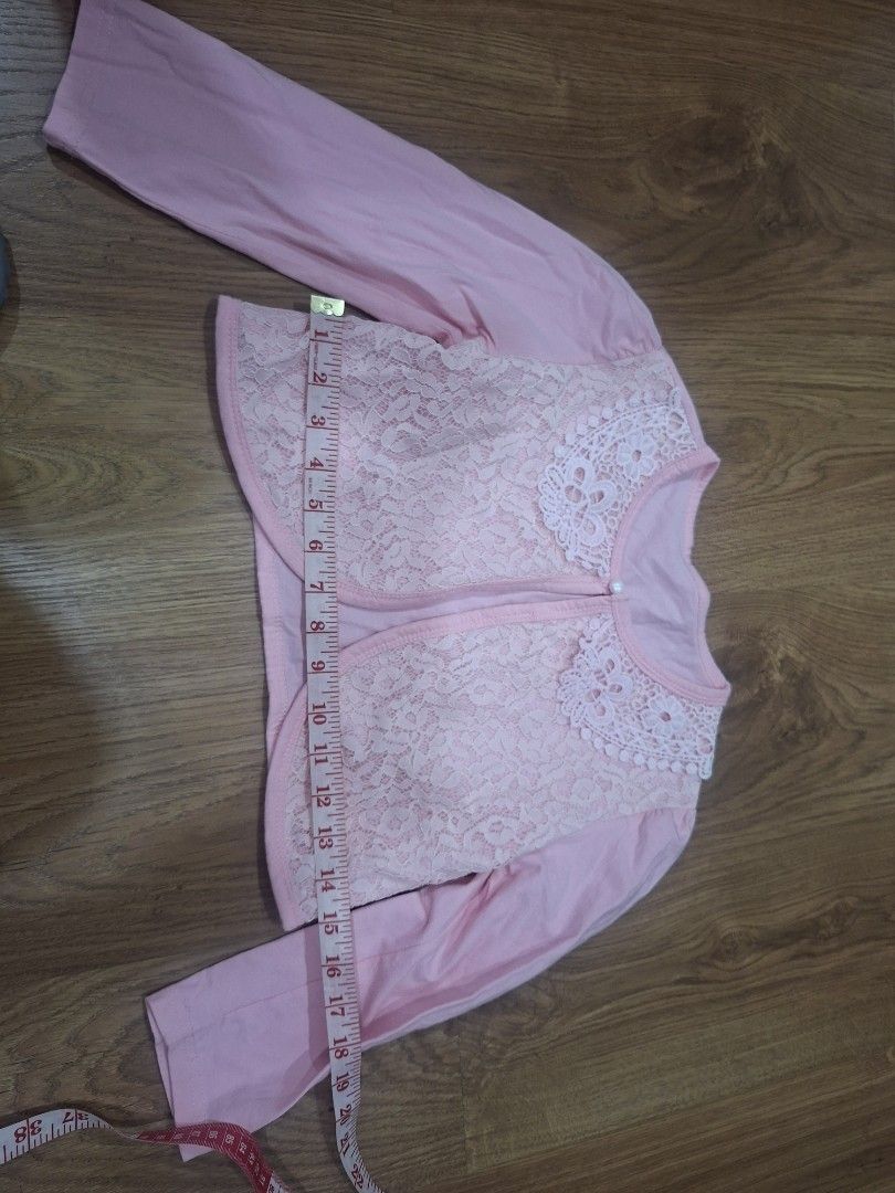 Pink Lace Bolero (Category: Others Tops) located in Manila. Submitted by kitto222 (Listing ID 1408583429, Image 2). Description: - Pink bolero with delicate lace overlay - Charming lace collar - Long sleeves - Button closure - Great for layering over dresses/tops - Stylish addition to any little girl's wardrobe.