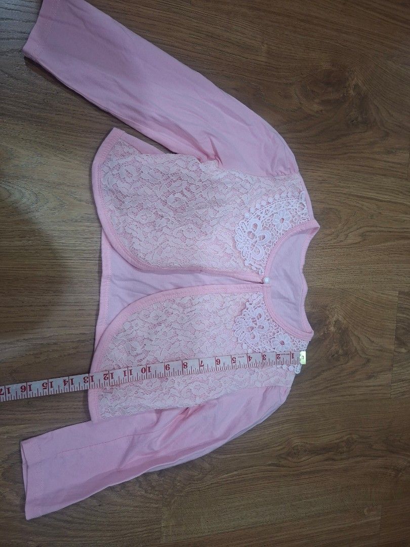 Pink Lace Bolero (Category: Others Tops) located in Manila. Submitted by kitto222 (Listing ID 1408583429, Image 1). Description: - Pink bolero with delicate lace overlay - Charming lace collar - Long sleeves - Button closure - Great for layering over dresses/tops - Stylish addition to any little girl's wardrobe.