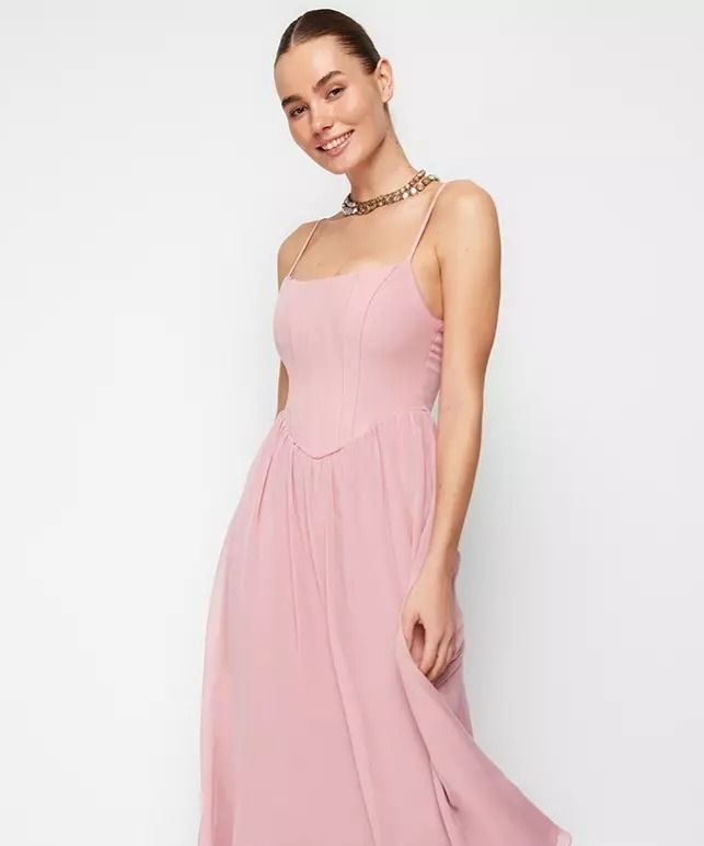 Pink Midi Dress with Spaghetti Straps (Category: Dresses) located in Makati City. Submitted by G4133 (Listing ID 1404260704, Image 2). Description: - Soft pink midi dress - Delicate spaghetti straps - Fitted bodice - Flared skirt - Flattering silhouette - Ideal for special occasions or daytime wear - Made from lightweight, flowing fabric.