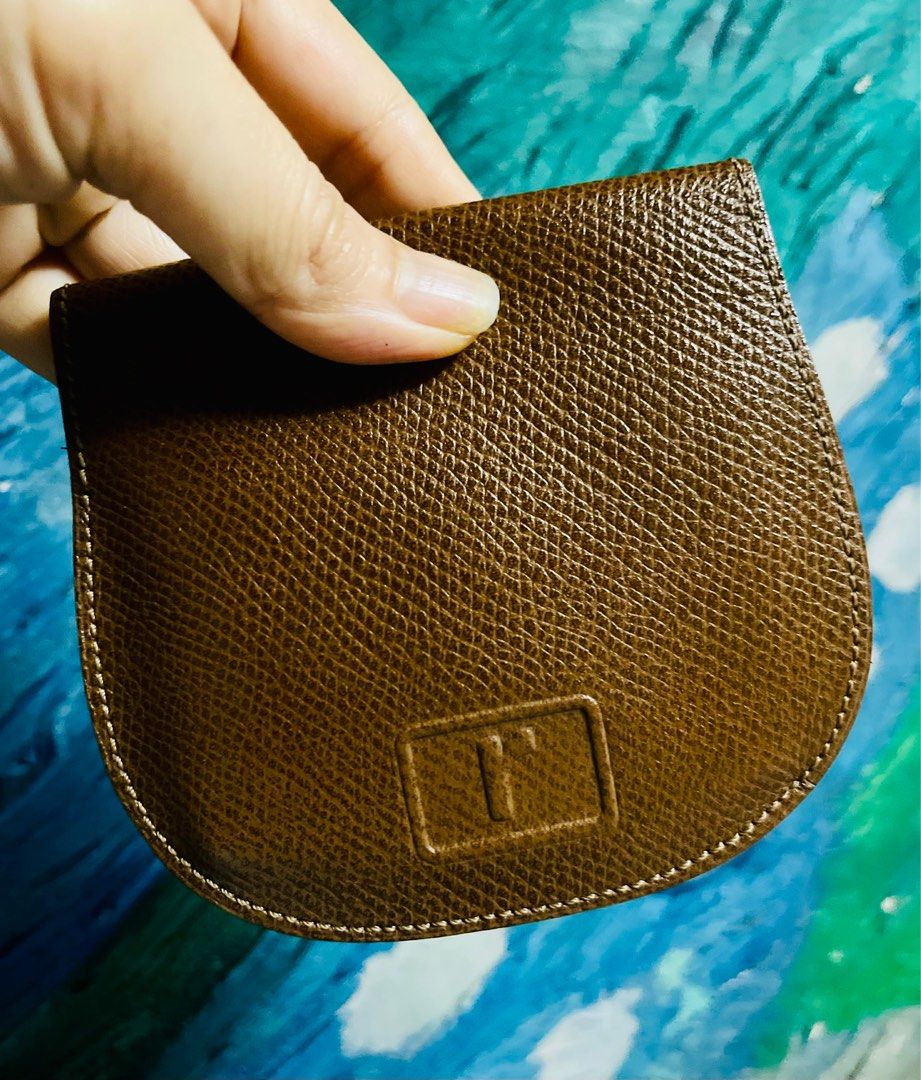 Renoma Couture Coin Purse (Category: Purses & Pouches) located in Antipolo. Submitted by MSelection (Listing ID 1408695652, Image 1). Description: - Renoma Couture coin purse - Brown textured leather - Snap closure - Multiple compartments for cards and coins - Brand name visible inside - Unique shape - Well-crafted.