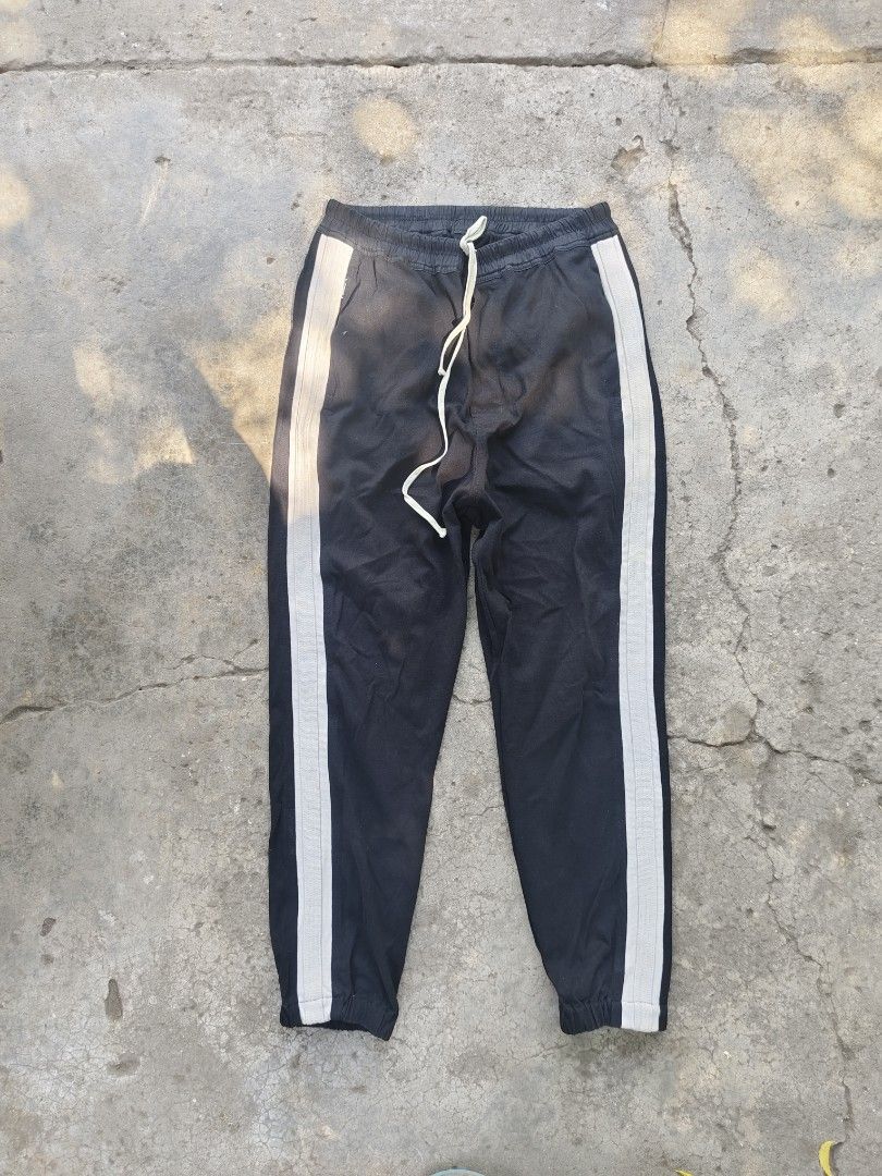 Rick Owens Babel S/S 19 Track Pants (Category: Joggers) located in Manila. Submitted by lux.mnl (Listing ID 1408522432, Image 1). Description: - Rick Owens track pants - Size: S/19 - Color: Black with white side stripes - Features: Drawstring waist, two pockets - Collection: Babel S/S 19 700 plus sf .