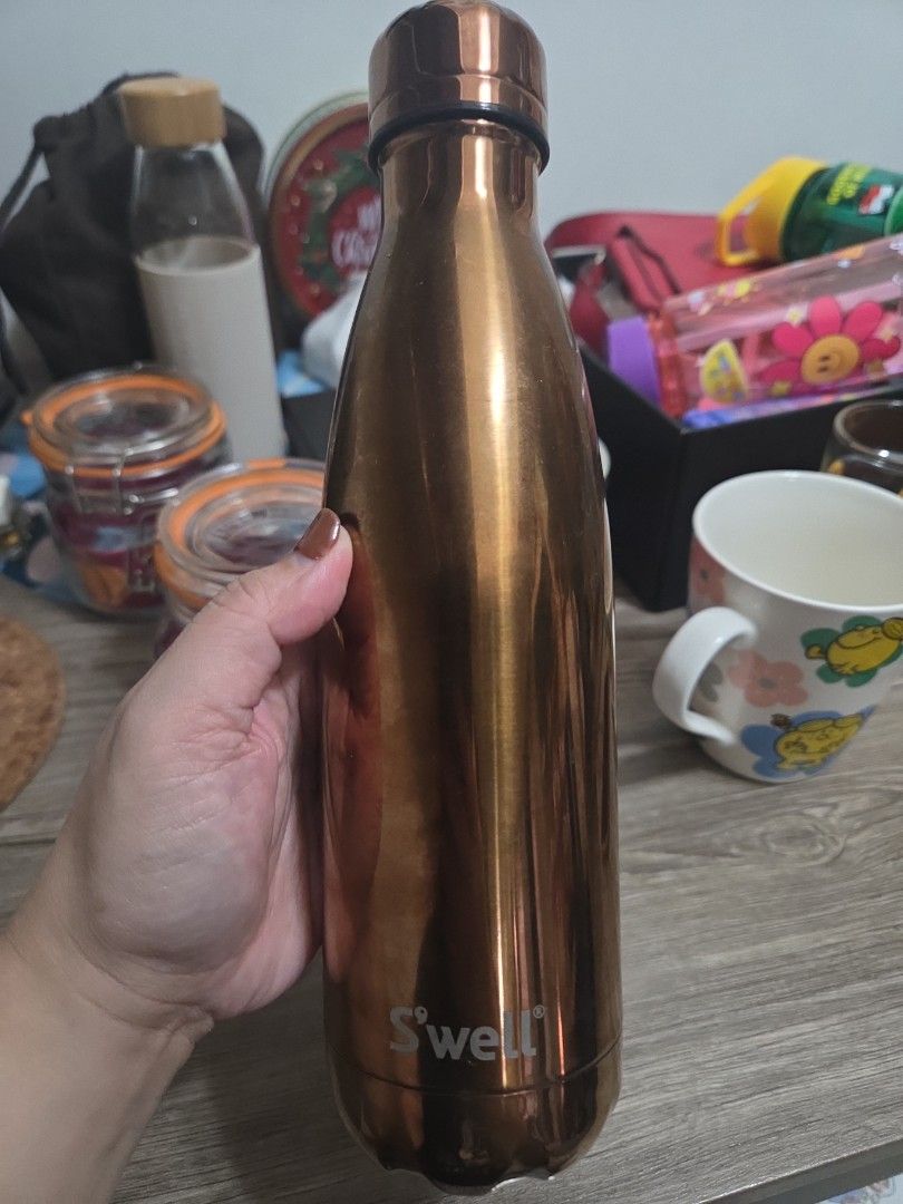 Starbucks Reserve S'well Water Bottle (Category: Water Bottles & Tumblers) located in Manila. Submitted by sterling_grace (Listing ID 1408580909, Image 2). Description: - Starbucks Reserve S'well water bottle - Stylish copper color - Sleek metallic finish - Black cap - Keeps drinks cold or hot - Perfect for on-the-go - Clean and well-maintained interior.