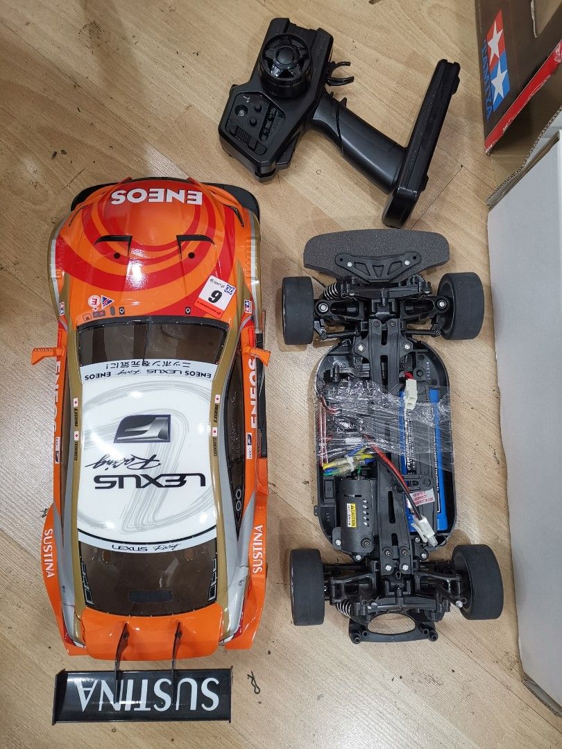 Tamiya ENEOS SUSTINA RC F TT-01 Type-E (Category: Vehicle & Diecast Models) located in Manila. Submitted by genesis11_21 (Listing ID 1408606278, Image 3). Description: - Tamiya ENEOS SUSTINA RC F 1/10 scale model - Includes car body and chassis - 2.4G radio control system included - Expert Built Xb Pro model - Item number: 57875 - Color scheme: Orange and white with ENEOS SUSTINA livery.