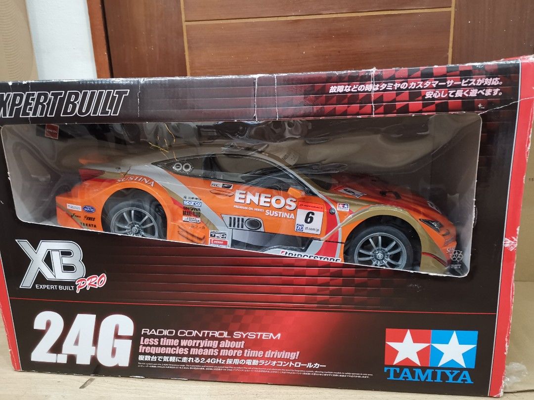 Tamiya ENEOS SUSTINA RC F TT-01 Type-E (Category: Vehicle & Diecast Models) located in Manila. Submitted by genesis11_21 (Listing ID 1408606278, Image 2). Description: - Tamiya ENEOS SUSTINA RC F 1/10 scale model - Includes car body and chassis - 2.4G radio control system included - Expert Built Xb Pro model - Item number: 57875 - Color scheme: Orange and white with ENEOS SUSTINA livery.