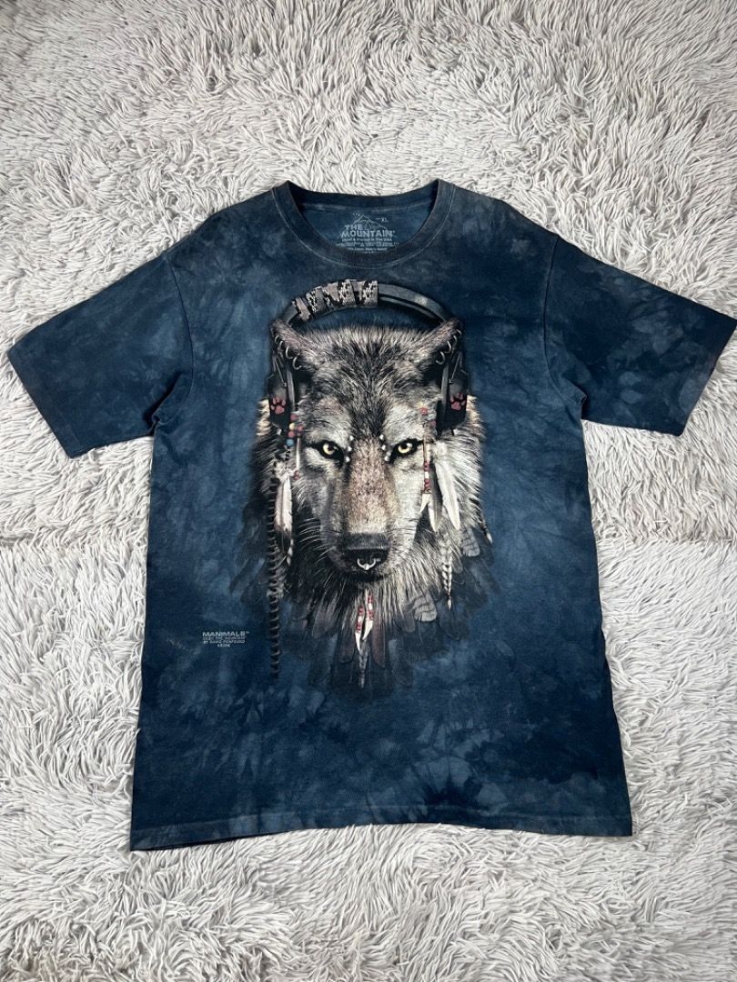 The Mountain Wolf T-shirt XL (Category: Tshirts & Polo Shirts ) located in Cebu City. Submitted by kayekallie (Listing ID 1408656345, Image 1). Description: - The Mountain t-shirt with a wolf graphic. - Features a cool tie-dye design. - Comfortable crew neck. - Size: XL - Material: 100% cotton. - Made in the USA. Width 20 Length 28.5.
