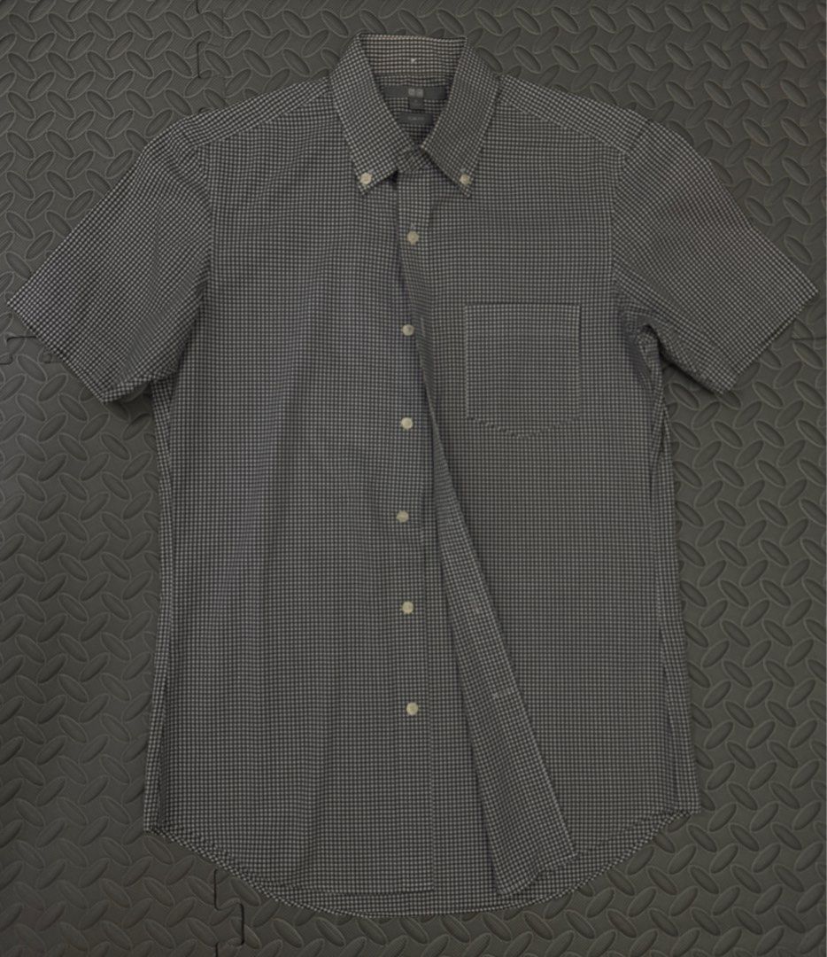 uniqlo b&w checked slim fit short-sleeve button-down (Category: Blouses) located in Rizal. Submitted by z00vi (Listing ID 1408576836, Image 1). Description: cut tag inside cus it was itchy helping my mom sell her work clothes :) can fit small to semi-med!.