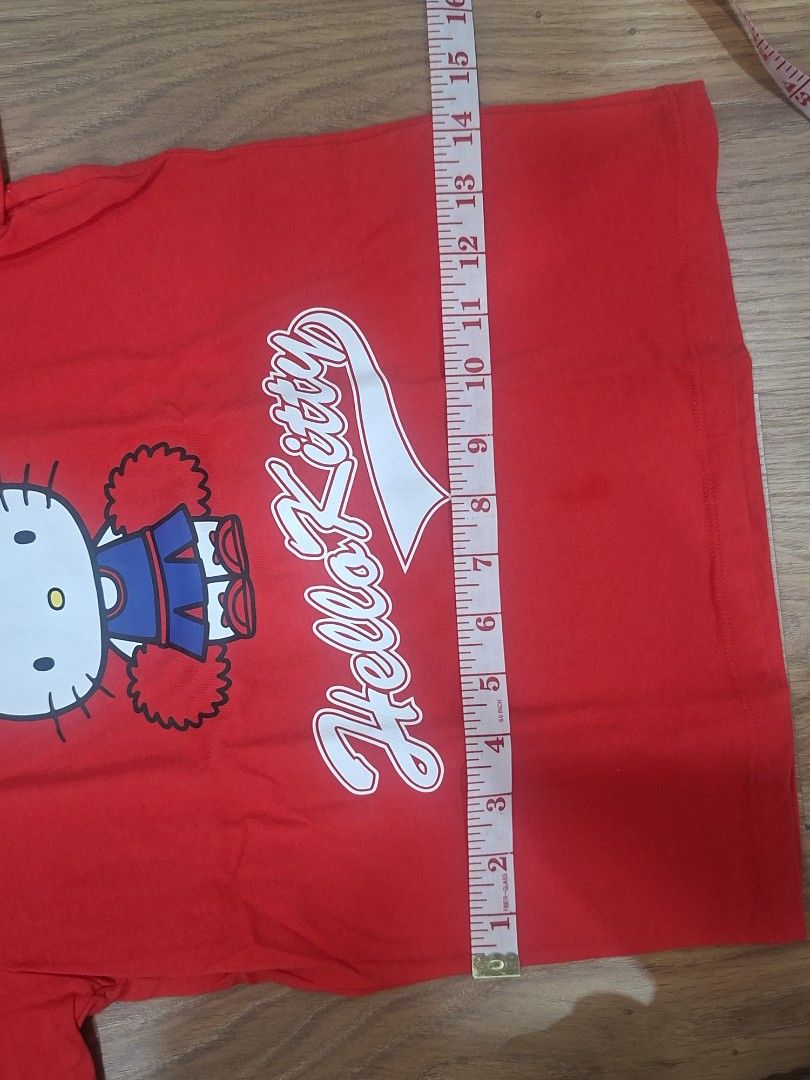 Uniqlo Hello Kitty Red T-shirt (Category: Shirts) located in Manila. Submitted by kitto222 (Listing ID 1408583729, Image 2). Description: - Uniqlo Kitty T-shirt - Red color - Features a Kitty graphic with " Kitty" script - Size: 130 - Crew neck and short sleeves - Made of soft material.