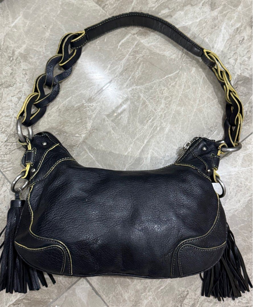 Vintage MCM black leather shoulder bag. (Category: Luxury Bags & Wallets) located in Cavite. Submitted by edendardar07 (Listing ID 1408687120, Image 2). Description: Shoulder bag with yellow contrast stitching and braided strap detail. 6/10 Silver Hardware 85% Rubs on lining.
