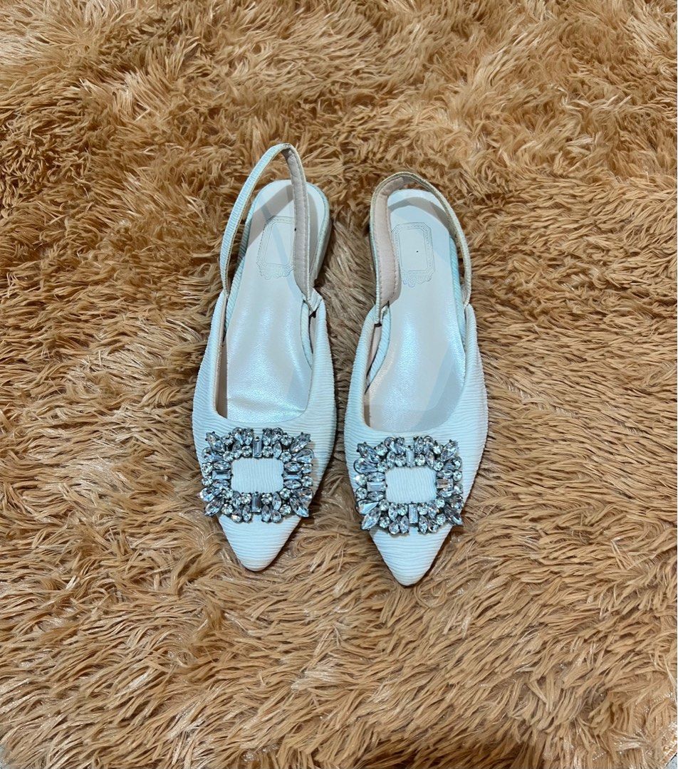 White Rhinestones Pointed Flat Shoes (Category: Flats & Sandals) located in Manila. Submitted by declutterwithC (Listing ID 1408540690, Image 1). Description: Size 8 Used 3-4x only. Sitting pretty sa shoe cabinet ko. 🥲 Classy when worn Shein Brand .