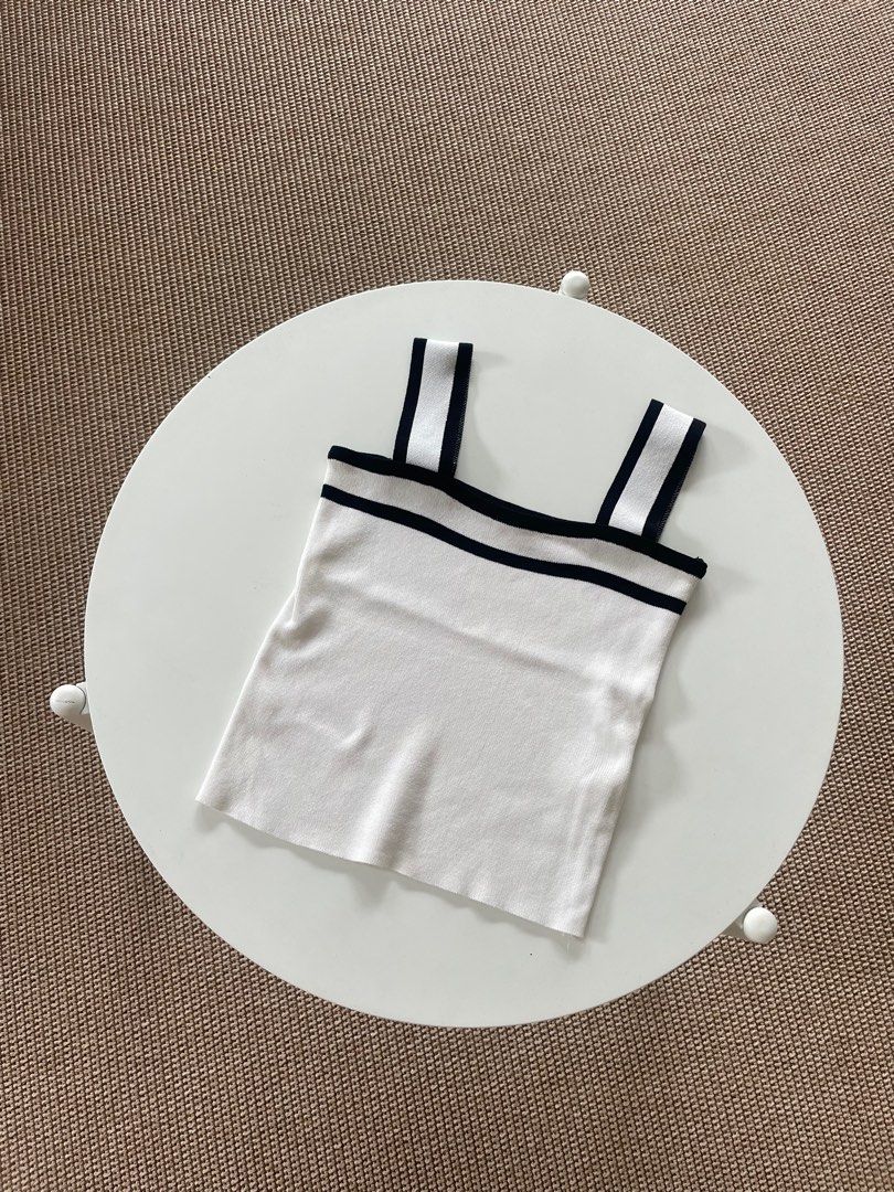 White Tank Top with Black Trim (Category: Sleeveless) located in Muntinlupa City. Submitted by henlo03 (Listing ID 1408542246, Image 1). Description: .