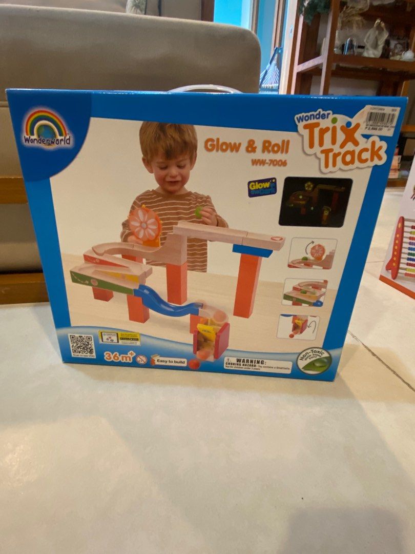 Wonderworld Trix Track Glow & Roll WW-7006 (Category: Educational & Learning Toys) located in Pasig City. Submitted by sms2019 (Listing ID 1408532093, Image 3). Description: - Wonderworld Trix Track Glow & Roll toy set. - Includes wooden track pieces, spiral, and other components. - Easy to build. - Features a glowing effect. - Designed for children aged 36 months and up..