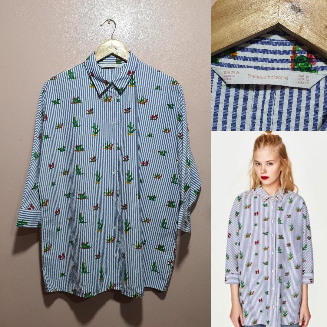 Zara Cactus Print Striped Shirt (Category: Shirts) located in Baguio. Submitted by dauntlessph (Listing ID 1408619665, Image 1). Description: - Zara shirt - Blue and white striped pattern with cactus print - Collared neckline - Long sleeves - Relaxed fit - Size: Medium - From the Trafaluc collection.