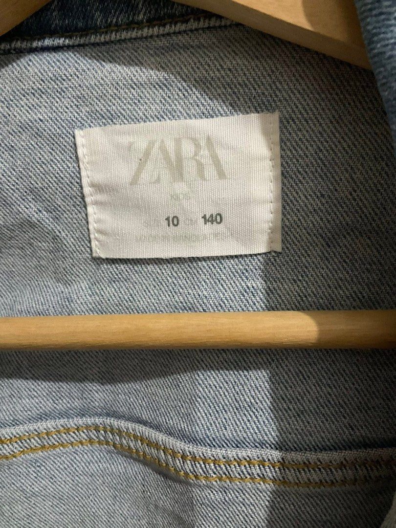 Zara Denim Jacket - Size 10 (Category: Coats, Jackets and Outerwear) located in Manila. Submitted by scorpiomoon00 (Listing ID 1408589173, Image 2). Description: - Zara kids denim jacket - Size 10 - Light blue wash - Button-down closure - Two chest pockets - Versatile for layering.