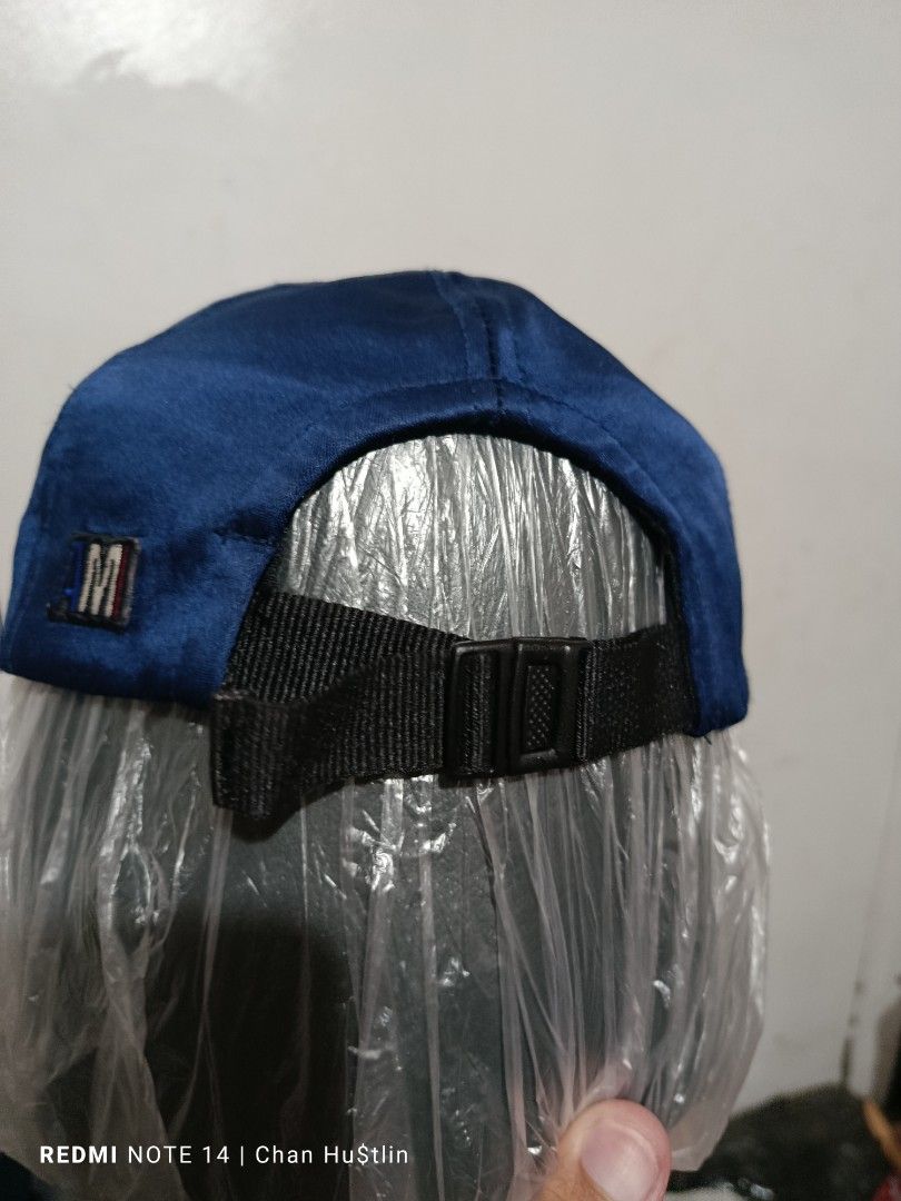 AMI Alexandre Mattiussi Navy Cap (Category: Caps & Hats) located in Calamba. Submitted by chanmagpantay (Listing ID 1408714361, Image 2). Description: - AMI Alexandre Mattiussi navy cap - Features the AMI logo - Adjustable black strap - Made in Portugal - Interior with striped pattern - Made of a velvet-like material - Like New - Excellent Condition - Color: Navy blue.