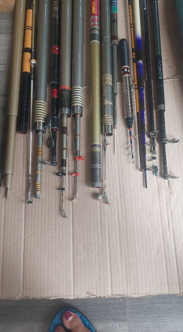 Assorted Fishing Rods (15 pcs) (Category: Fishing) located in Bulacan. Submitted by ourdailyfinds (Listing ID 1408840300, Image 2). Description: Collection of various fishing rods. Includes rods of different lengths and designs, some with visible brand markings. Also includes rod holders and a carrying case. The rods appear to be made of different materials, including carbon fiber. Some rods have visible reel seats and guides. Notes: Payment: GCa