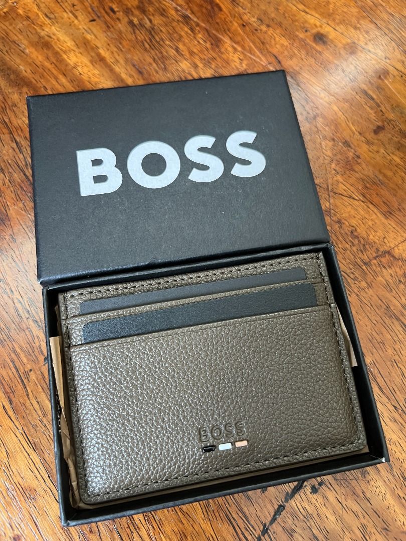 BOSS Leather Cardholder Wallet (Category: Wallets & Card Holders) located in Quezon City. Submitted by jhernan2000 (Listing ID 1408769555, Image 1). Description: BOSS Ray Card Holder Legit. Brand New. Unused. Still in box. Php 5,000.00 Color: Brown Features: - 5 card slots - Embossed logo detail to front - Hardware logo detail at front - Height: 7cm - Length: 10cm *MOP: BPI, Unionbank, GCash or Maya* *NOT FOR TRADE / SWAP* *SHIPPING / PICK UP C/O