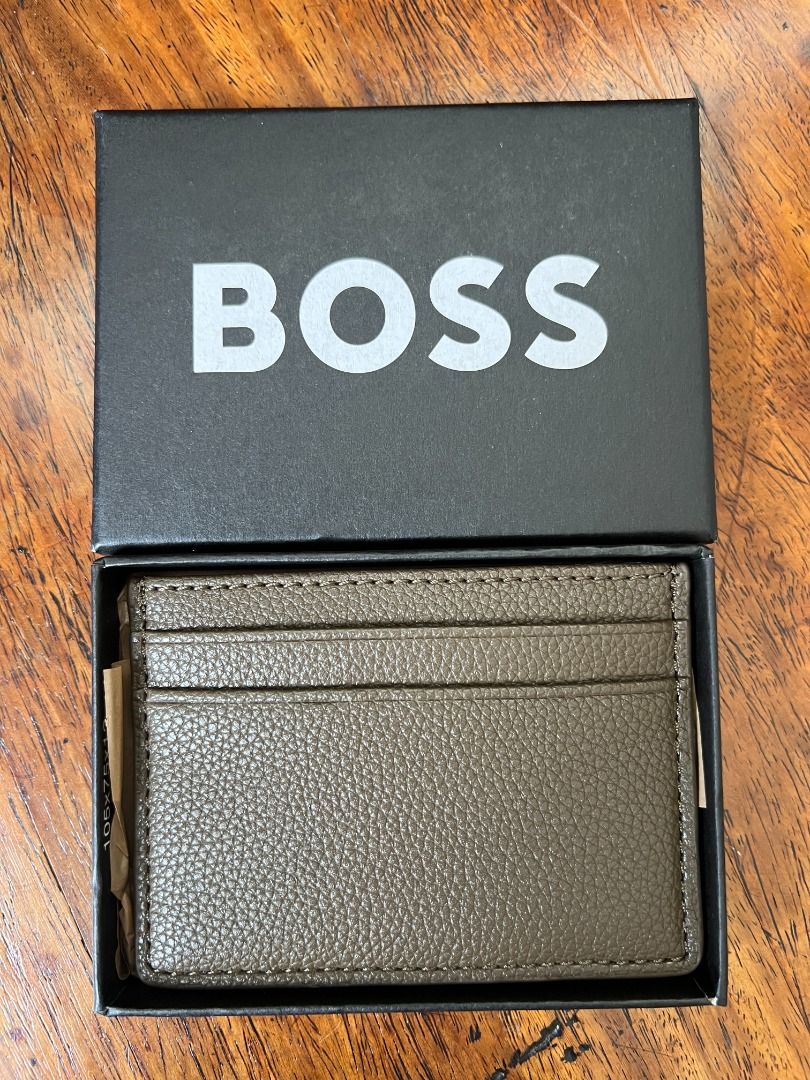 BOSS Leather Cardholder Wallet (Category: Wallets & Card Holders) located in Quezon City. Submitted by jhernan2000 (Listing ID 1408769555, Image 3). Description: BOSS Ray Card Holder Legit. Brand New. Unused. Still in box. Php 5,000.00 Color: Brown Features: - 5 card slots - Embossed logo detail to front - Hardware logo detail at front - Height: 7cm - Length: 10cm *MOP: BPI, Unionbank, GCash or Maya* *NOT FOR TRADE / SWAP* *SHIPPING / PICK UP C/O