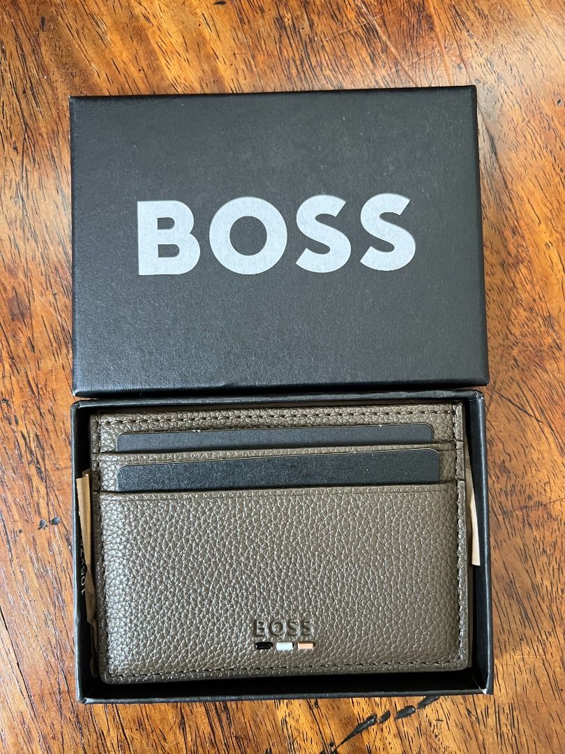 BOSS Leather Cardholder Wallet (Category: Wallets & Card Holders) located in Quezon City. Submitted by jhernan2000 (Listing ID 1408769555, Image 2). Description: BOSS Ray Card Holder Legit. Brand New. Unused. Still in box. Php 5,000.00 Color: Brown Features: - 5 card slots - Embossed logo detail to front - Hardware logo detail at front - Height: 7cm - Length: 10cm *MOP: BPI, Unionbank, GCash or Maya* *NOT FOR TRADE / SWAP* *SHIPPING / PICK UP C/O