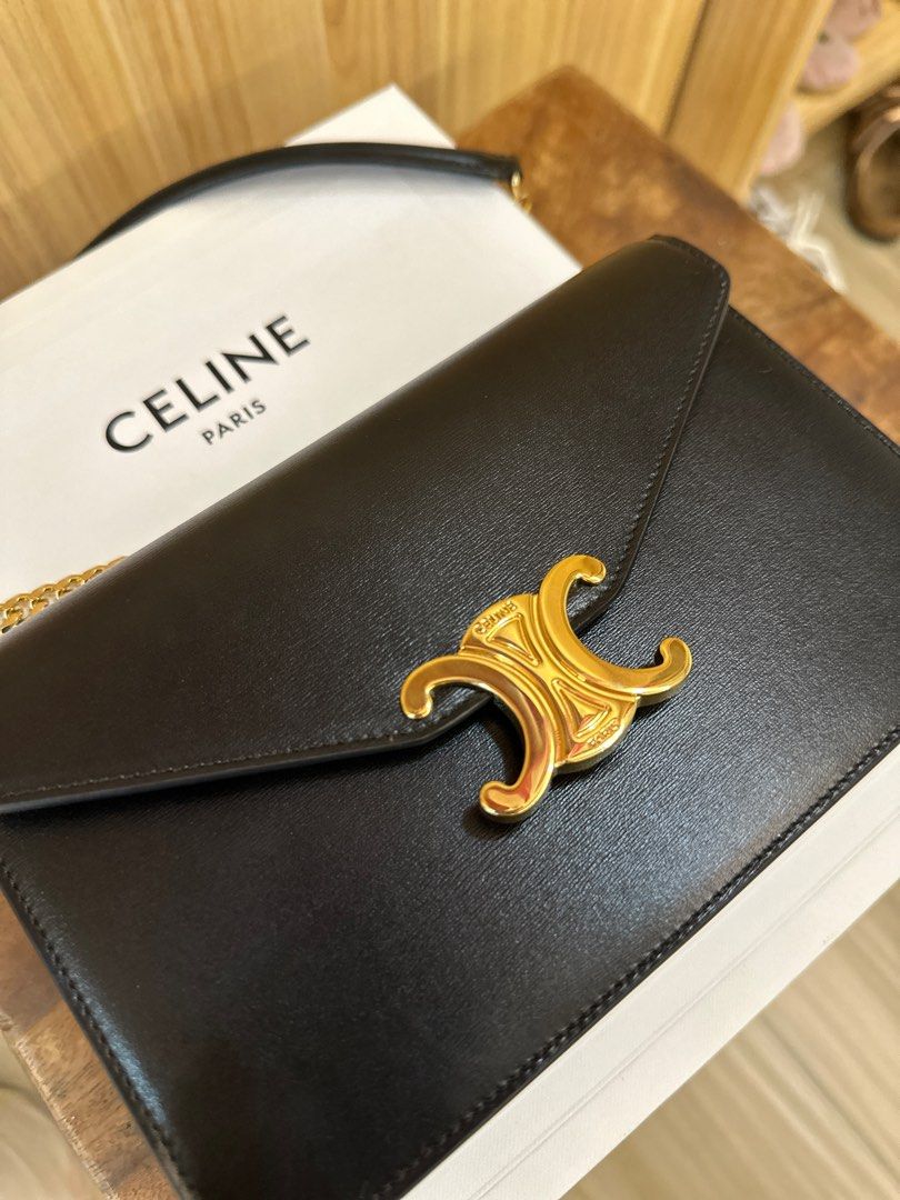 Celine Triomphe Chain Bag (Category: Luxury Bags & Wallets) located in San Pablo. Submitted by _studioelaine (Listing ID 1408863595, Image 3). Description: - Celine Triomphe Chain Bag - Black color - Gold-tone chain strap - Iconic Triomphe logo clasp - Includes original box, dust bag, and card - Single interior compartment - Classic and stylish design.