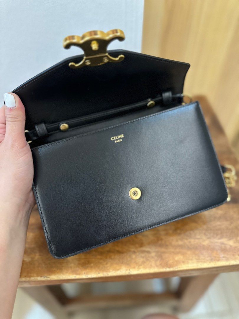 Celine Triomphe Chain Bag (Category: Luxury Bags & Wallets) located in San Pablo. Submitted by _studioelaine (Listing ID 1408863595, Image 2). Description: - Celine Triomphe Chain Bag - Black color - Gold-tone chain strap - Iconic Triomphe logo clasp - Includes original box, dust bag, and card - Single interior compartment - Classic and stylish design.