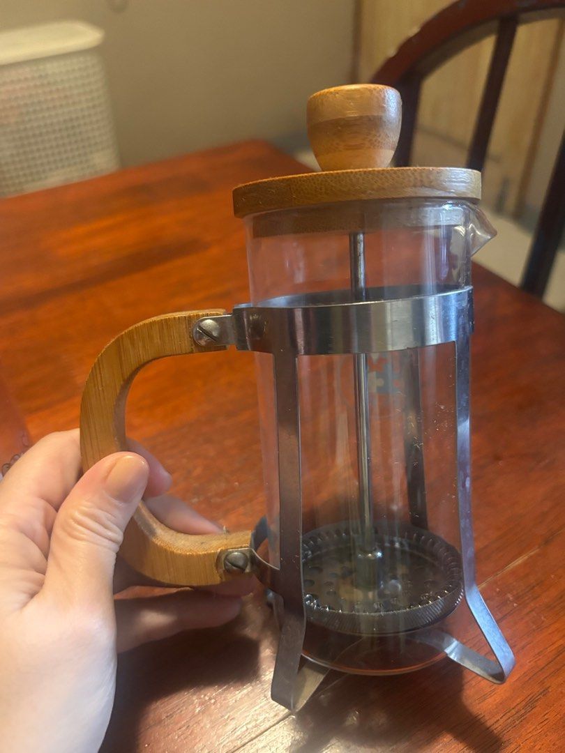 Coffee and tea (Category: Coffee Machines & Makers) located in Manila. Submitted by hotstuffmanila (Listing ID 1408704277, Image 2). Description: 1. French press coffee maker with a bamboo lid and handle. It features a heat-resistant glass carafe. The stand and plunger mechanism are made of stainless steel. It is a manual brewing device that allows for steeping coffee grounds to produce a rich, full-bodied brew. The design, with natural bamboo el