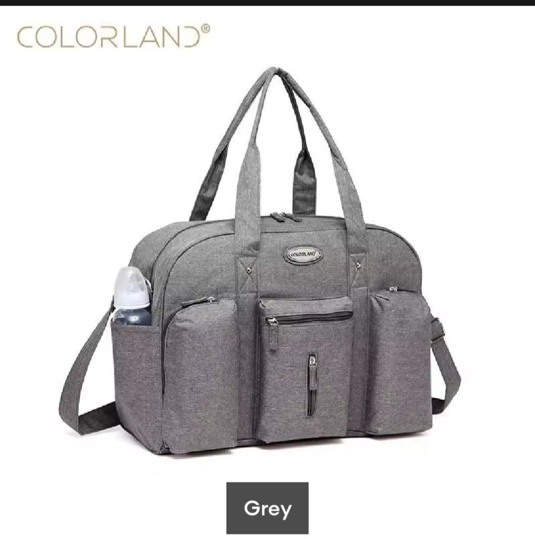 Colorland Diaper Bag - Grey (Category: Diaper Bags & Wetbags) located in Pasig City. Submitted by apscloset (Listing ID 1408804021, Image 1). Description: Preloved diaper bag... Still in great condition... Price negotiable for serious buyers... Stylish and spacious Colorland diaper bag. Features multiple pockets: 1 main bag, 3 front pockets, 2 side pockets, and 1 back pocket. Includes a shoulder strap, wet bag, and change pad. The adjustable shou