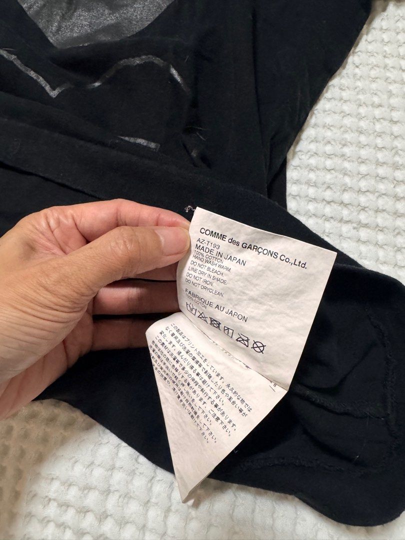 Comme des Garcons Play Double Heart T-shirt (Category: Shirts) located in Pasig City. Submitted by geezmeez (Listing ID 1408813705, Image 3). Description: - Black Comme des Garcons Play T-shirt - Features a double heart design on the front - Brand name displayed on the back - Made in Japan - Crew neck and short sleeves - Size: L women’s .