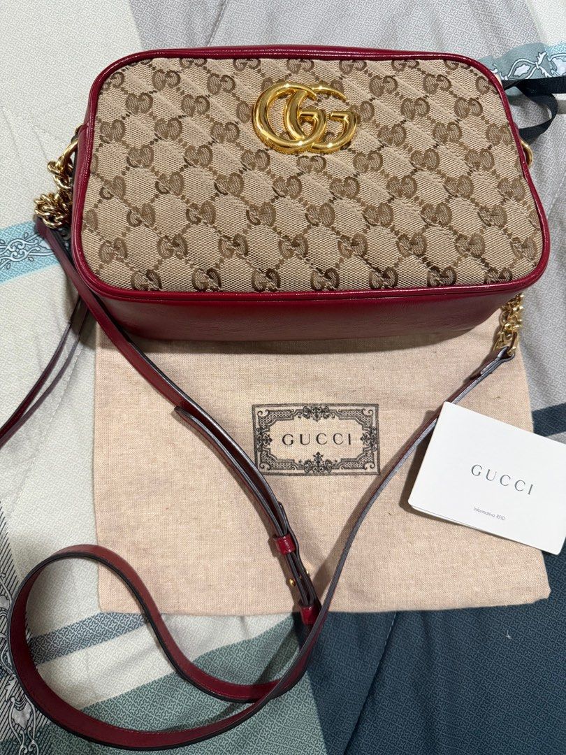 Gucci Marmont Camera Bag (Category: Luxury Bags & Wallets) located in Taguig. Submitted by Zyannah (Listing ID 1408703527, Image 2). Description: Preloved authentic Gucci Marmonr Camera Bag. With dustbag and card. No issues or major flaws to declare. Well loved and personally pre-owned. Country of origin: Italy Date / authenticity code: 447632 520981 Measurements: 9.5”L x 2.5”W x 6.5”H Exterior pockets: N/A Interior pockets: One open pocket Handl