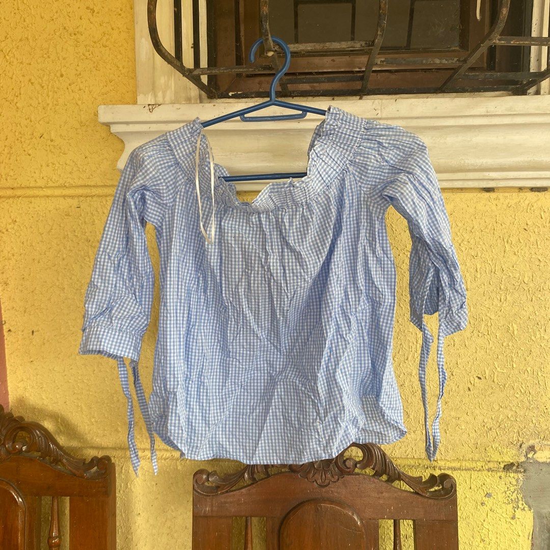 H&M Divided Off-Shoulder Top (Category: Blouses) located in Caloocan City. Submitted by ven_thrifts (Listing ID 1408795447, Image 2). Description: - H&M Divided top - Blue and white checkered pattern - Off-shoulder design - Long sleeves - Tie details at cuffs - Size 4 - Suitable for various occasions.