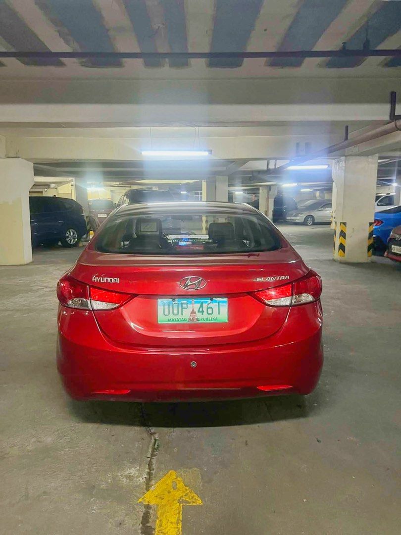 Hyundai Elantra 1.6 GL (A) (Category: Used Cars) located in Mandaluyong City. Submitted by len0127 (Listing ID 1408879594, Image 3). Description: Price Negotiable! Only to direct buyers. 1st Owned Year: 2013 Mileage: 64,000 Color: Tomato Red Leather Seats The unit have low mileage and parking is in our building basement. Freshly painted just Oct 2025 Tune Up last Oct 2025 RFS: Barely used since we have other owned cars and we have company service