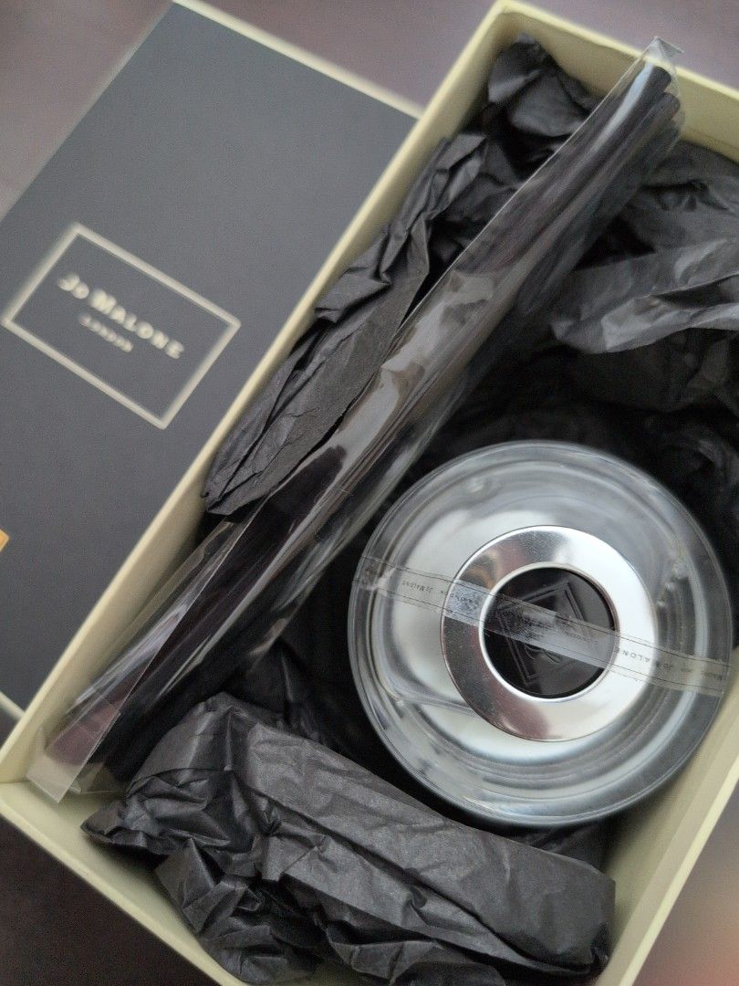 Jo Malone Diffuser (Category: Other Home Decor) located in Singapore. Submitted by m.allure (Listing ID 1408752869, Image 2). Description: - Brand: Jo Malone - Type: Diffuser - Condition: New in packaging - Includes: Reeds - Design: Sleek and elegant - Perfect for: Adding a touch of luxury to your home.