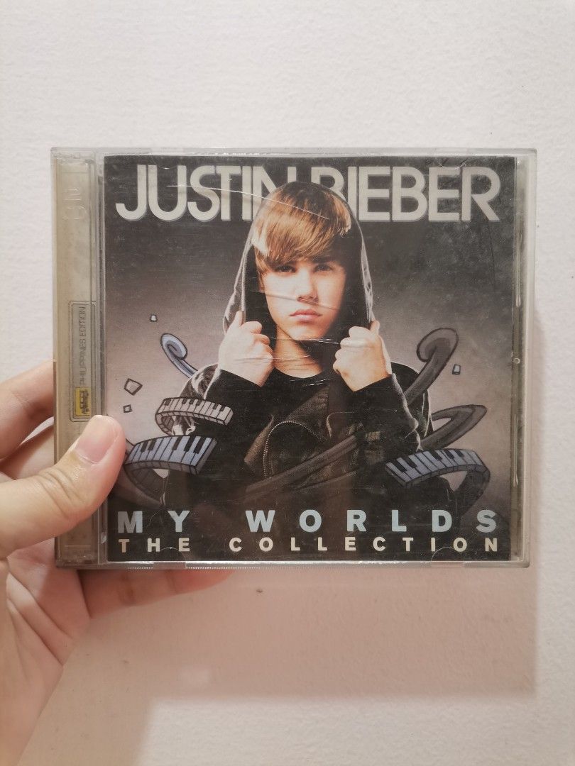 Justin Bieber CD Collection (Category: CDs & DVDs) located in Makati City. Submitted by kookybearsstuff (Listing ID 1408735004, Image 2). Description: Collection of Justin Bieber CDs. Includes "My Worlds The Collection" and "Never Say Never The Remixes". The receipt from SM Mall of Asia is included, dated March 27, 2011. The CDs are in their original cases..
