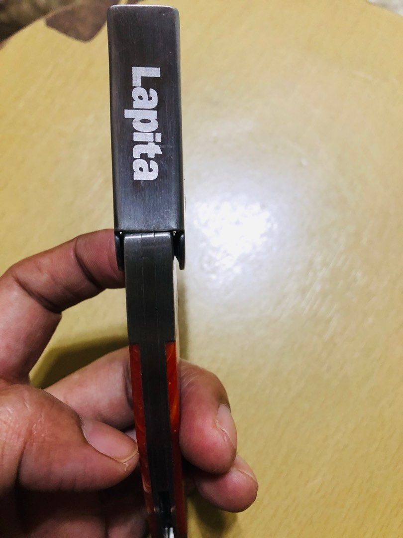 Lapita Wine Opener (Category: Other Kitchenware & Tableware) located in Manila. Submitted by noemiaspa1702 (Listing ID 1408718971, Image 1). Description: - Lapita wine opener - Features corkscrew, bottle opener, and knife - Red and silver design - Wooden handle - Made of metal - Compact size - Perfect for opening wine bottles.