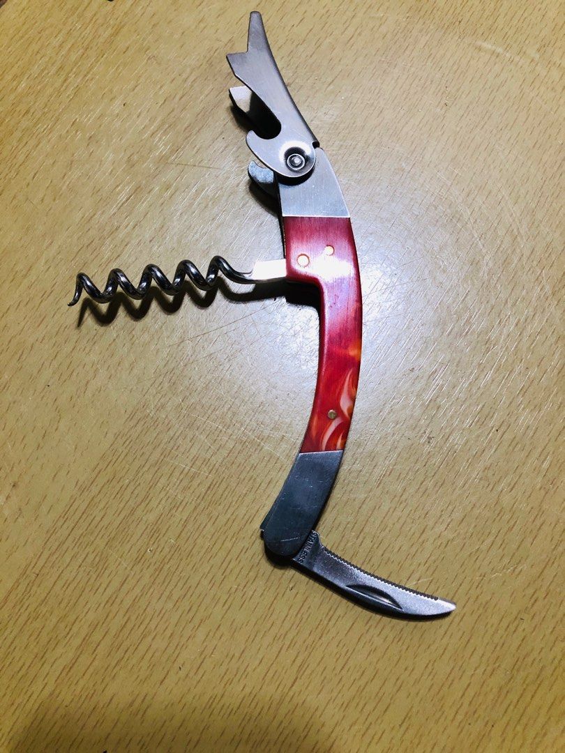 Lapita Wine Opener (Category: Other Kitchenware & Tableware) located in Manila. Submitted by noemiaspa1702 (Listing ID 1408718971, Image 3). Description: - Lapita wine opener - Features corkscrew, bottle opener, and knife - Red and silver design - Wooden handle - Made of metal - Compact size - Perfect for opening wine bottles.