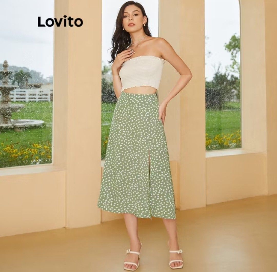 Lovito Floral Slit Midi Skirt (Category: Skirts) located in Manila. Submitted by _thriftatbp (Listing ID 1408806529, Image 1). Description: - Features a floral print and a slit on the side - High waist design and is made of a lightweight fabric - Suitable for casual wear and can be paired with various tops.