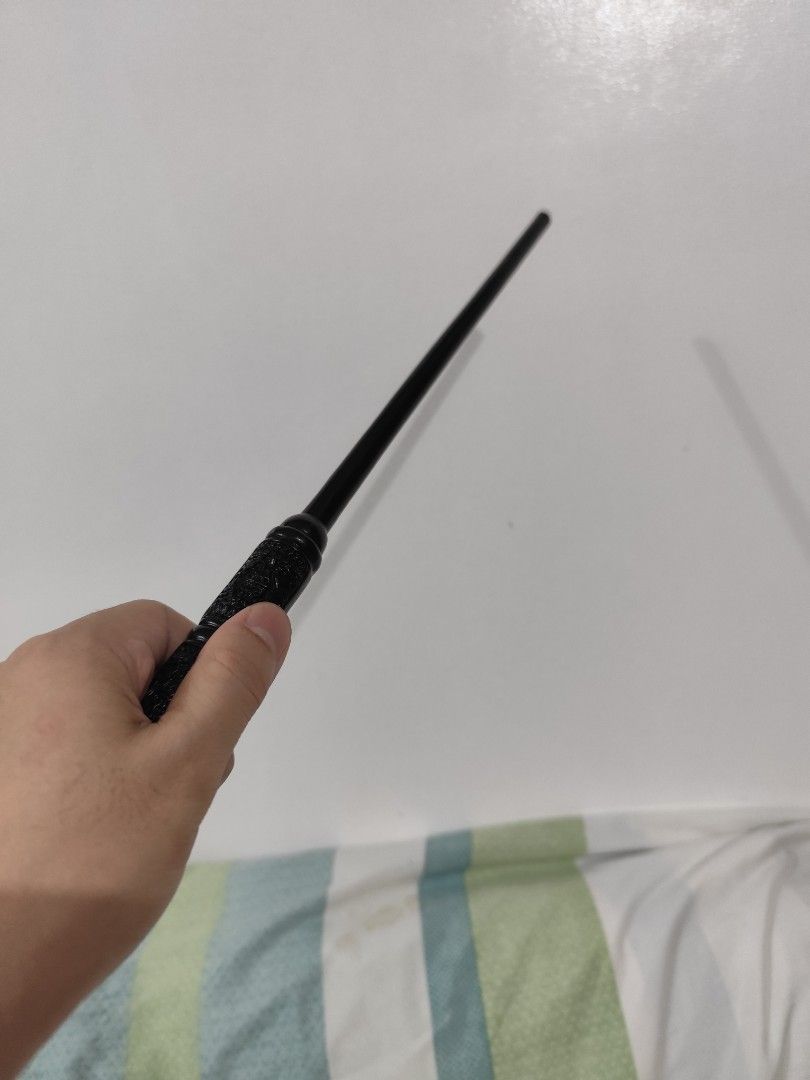 HARRY POTTER WAND - Magic Wand with Box (Category: Western Merchandise) located in Taguig. Submitted by emmanskie10 (Listing ID 1408740673, Image 3). Description: - Black magic wand - Harry Potter Wand - Detailed handle - Includes box and charging cable - used only once - Perfect for cosplay or gifts - Great for Harry Potter fans.