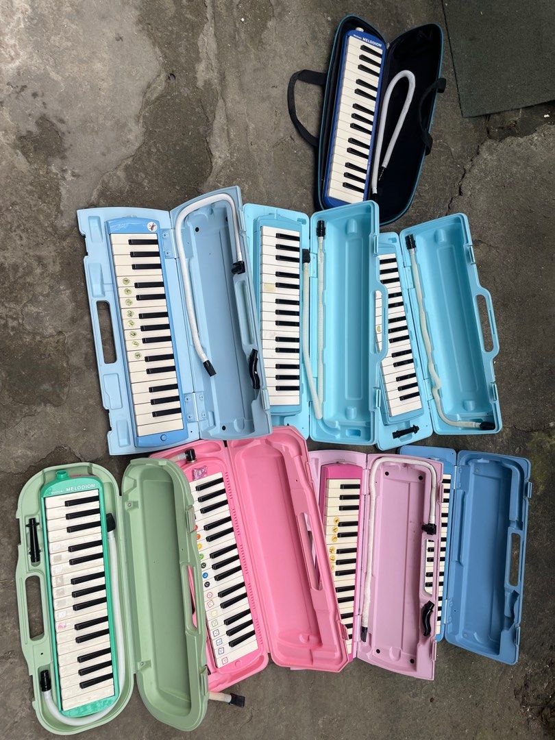 Melodica Keyboard with Case (Category: Musical Instruments) located in Quezon City. Submitted by eilgaraje (Listing ID 1408879550, Image 2). Description: - Melodica keyboards with matching cases and mouthpieces. - Available case colors: blue, pink, and green. - Keyboards have white and black keys. - Some cases include a handle. -250 each .