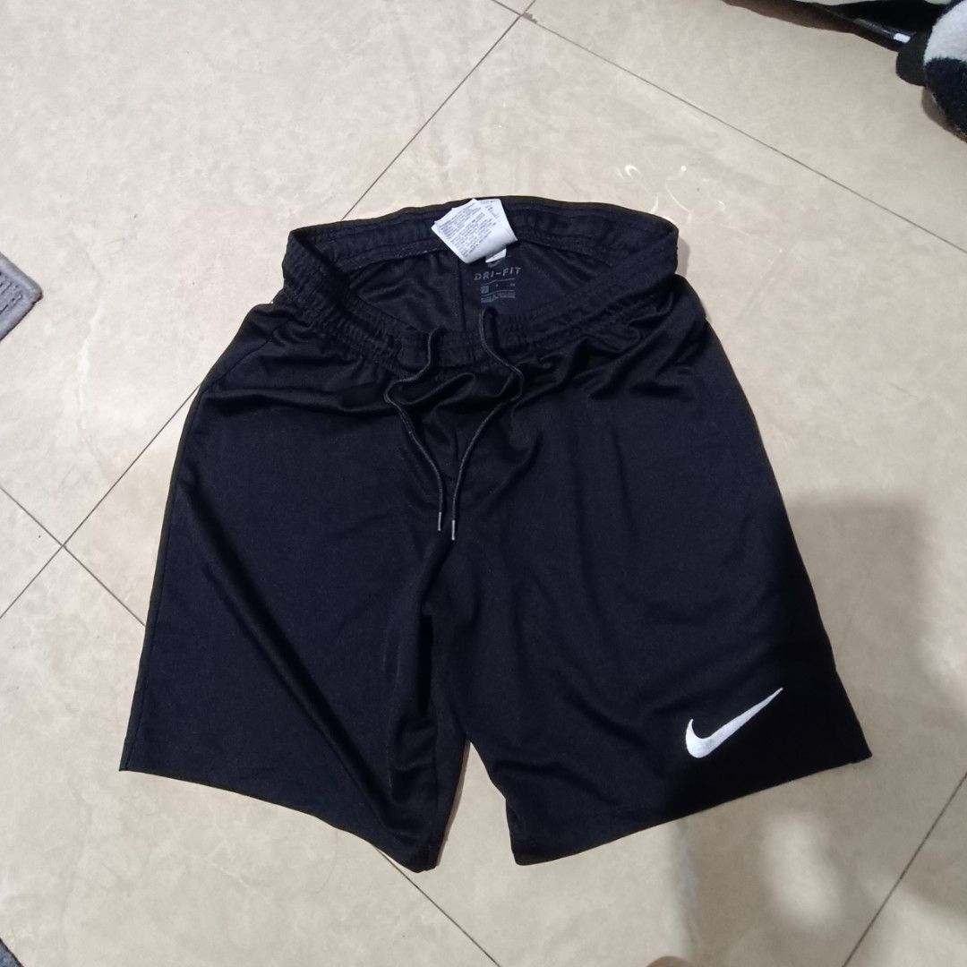 Nike Dri-FIT Black Shorts (Category: Shorts) located in Davao. Submitted by ashton14 (Listing ID 1408811312, Image 1). Description: - Black Nike Dri-FIT shorts - Drawstring waistband - White Nike logo - Breathable athletic material - Includes a small tag - Great for workouts or casual wear.
