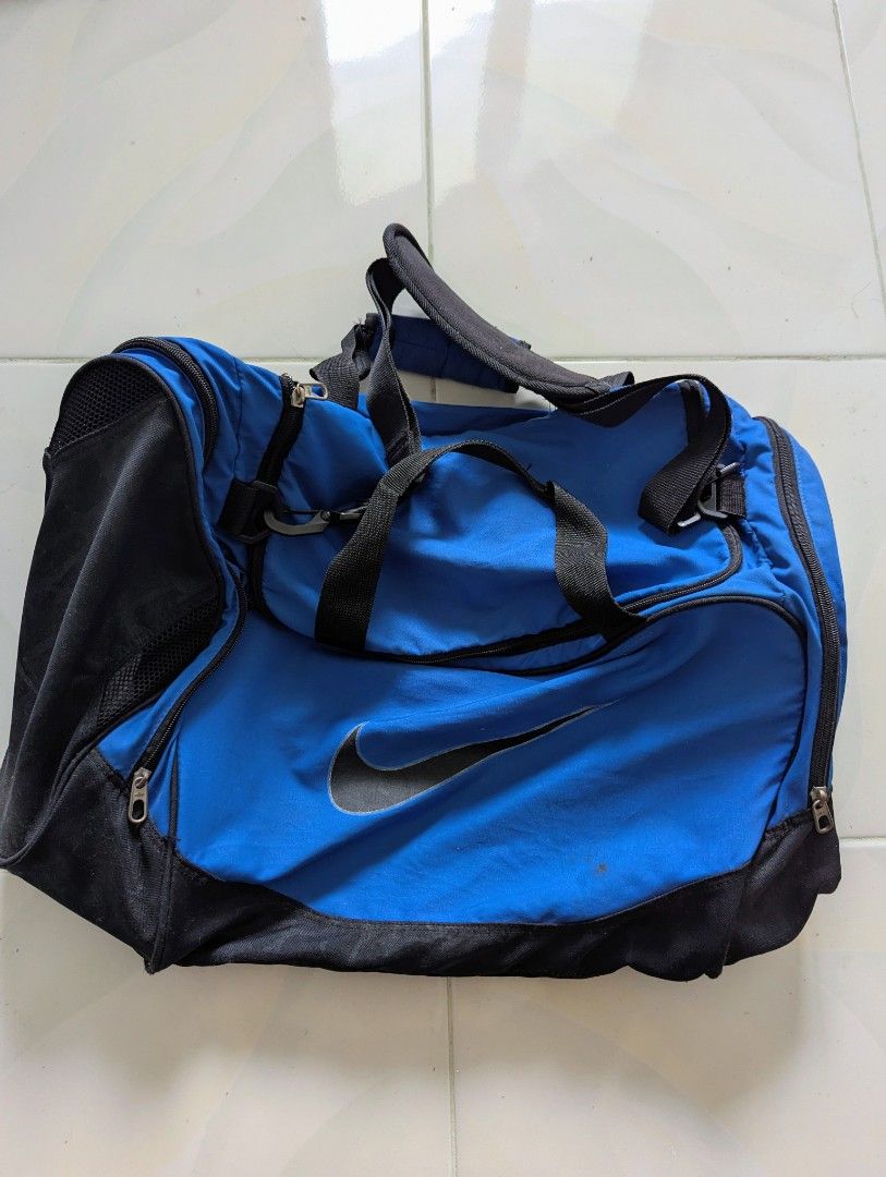 Nike Gym Bag (Blue) (Category: Sling Bags) located in Tarlac. Submitted by frift_ (Listing ID 1408723251, Image 1). Description: Nike Elite Gym Bag -breathable material -mesh compartment for dirty clothes/shoes -zippers all working -complete straps issue: needs washing shipping fee +50.