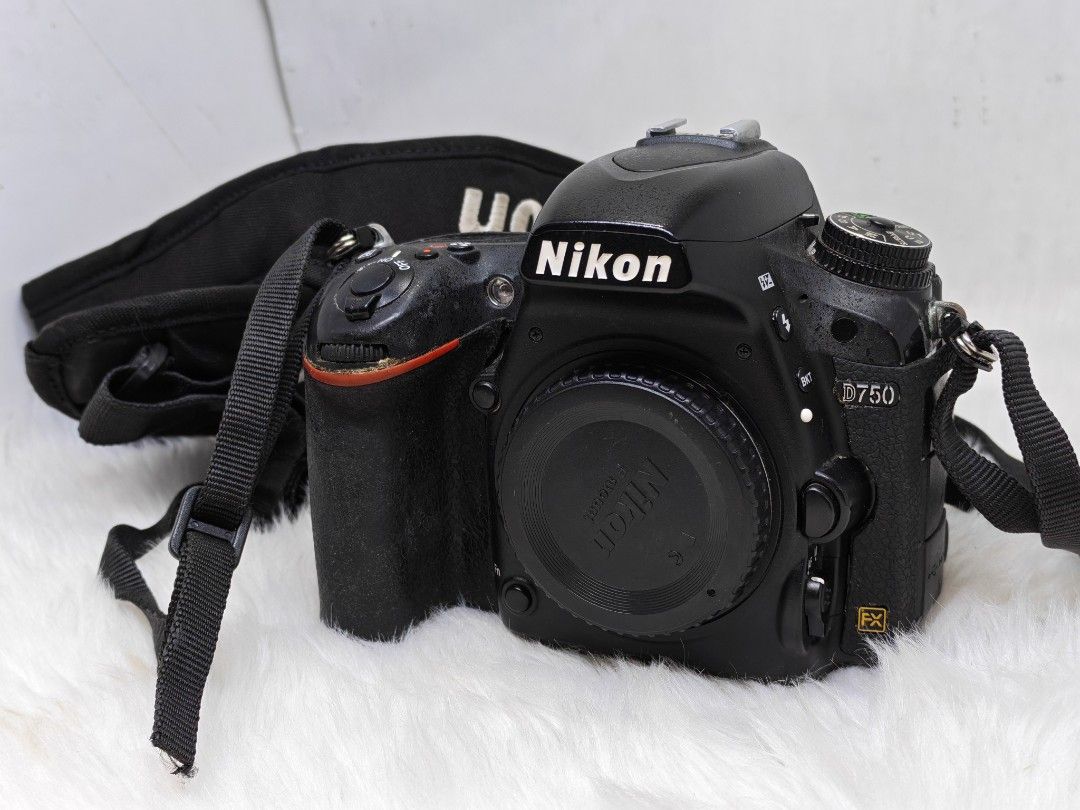 Nikon D750 Full Frame DSLR Camera body (Category: Cameras) located in Manila. Submitted by ultimogizmos (Listing ID 1408879531, Image 2). Description: - Nikon D750 DSLR camera body - Includes lens cap and strap - Features built-in flash - Nikon logo on strap - Screen displays setup menu - Camera in good working Key Features: Sensor: 24.3MP FX-format CMOS sensor (full-frame). Processor: EXPEED 4. ISO: Expandable up to 51200, excellent high-ISO per