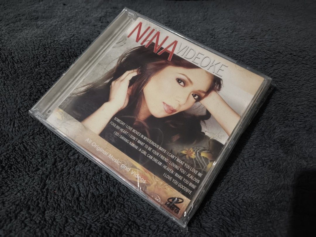 Nina Videoke CD (Category: CDs & DVDs) located in Quezon City. Submitted by kevinfuentes0219 (Listing ID 1408714684, Image 1). Description: CD features Nina's Videoke tracks. The CD includes songs like "Someday", "Love Moves in Mysterious Ways", and "I Can't Make You Love Me". It also includes other tracks such as "Foolish Heart", "I Don't Want to Be Your Friend", "Loving You", "Jealous", "Sayang Naman", "A Girl Can Dream", "Heaven", "Make You Mi