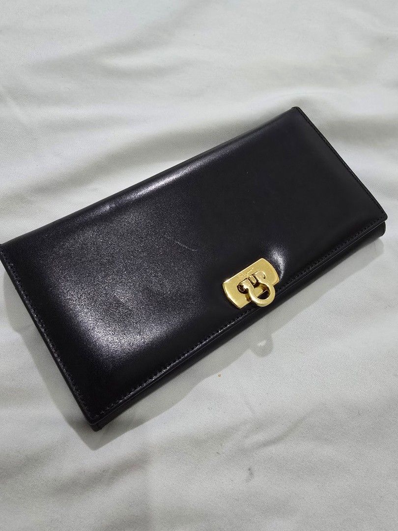 Original Salvatore Ferragamo Long Wallet (Category: Luxury Bags & Wallets) located in Cavite. Submitted by everythingjapan (Listing ID 1408876253, Image 1). Description: original ferragamo wallet almost new BUT WITH FLAWS: sticky coin pocket, cannot use. hence selling very low the wallet can still be used as is without the coin compartment or if u can clean it out or bring to a bag spa for cleaning. no inclusions 4 card slots 1 open pockets bill 